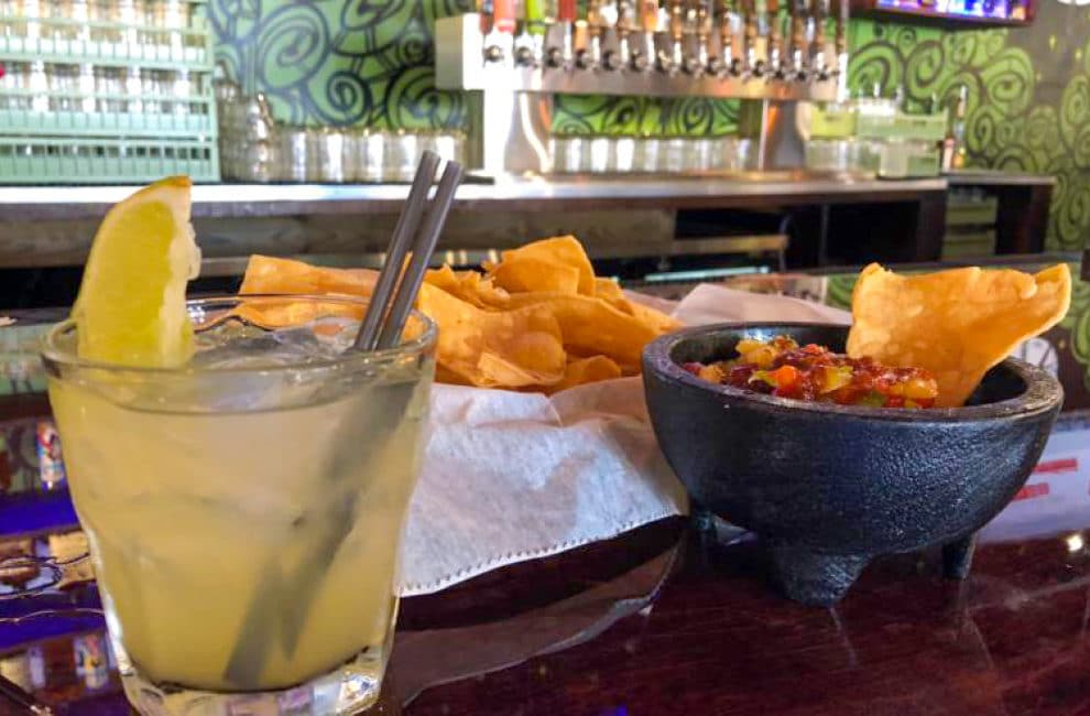 Condado chips and salsa and margarita at bar