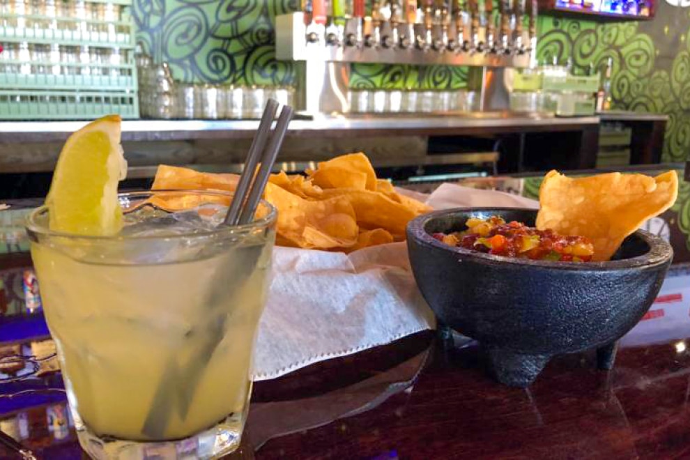 Condado chips and salsa and margarita at bar