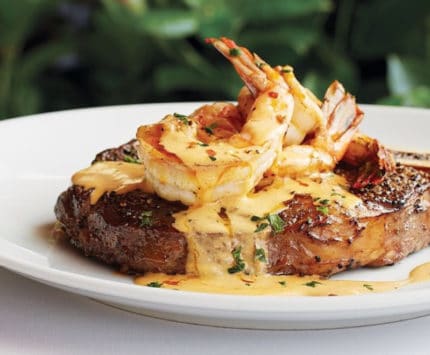 Bone-in ribeye with baked shrimp from Fleming's