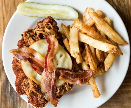 Open-face chicken sandwich with bacon and cheese at Sunrise Cafe