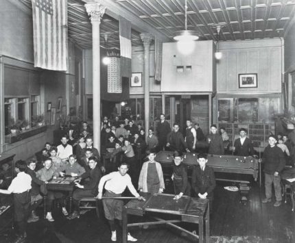 A group of boys playing pool in 1907.