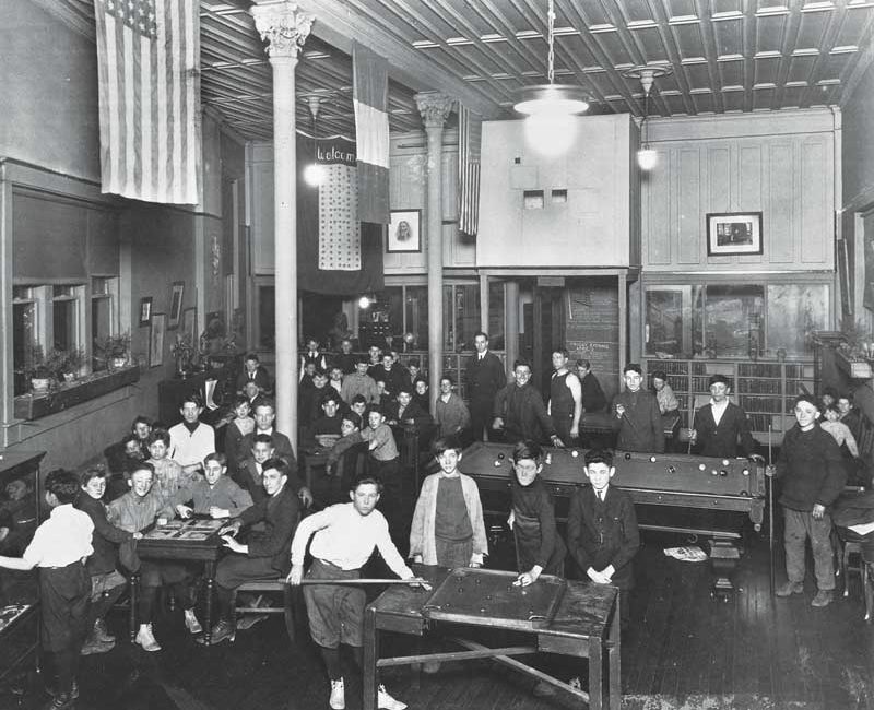 A group of boys playing pool in 1907.