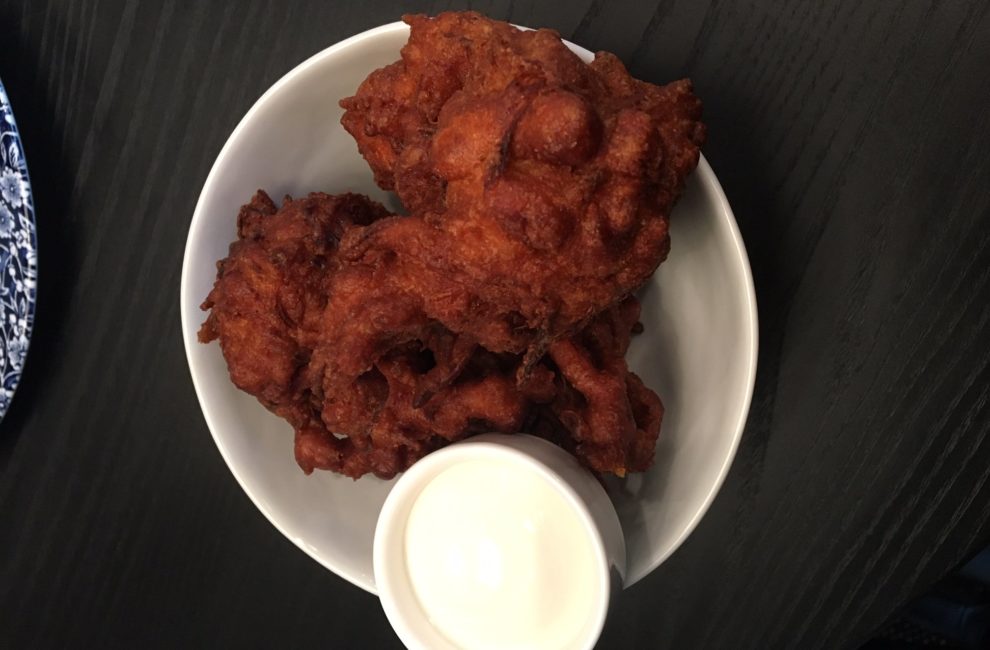 Picture of orange carrot fritters with a white dipping sauce