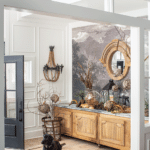 An oak cabinet sits in the home’s entryway with a black dog.