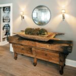 An aged and worn buffet table made of wood.