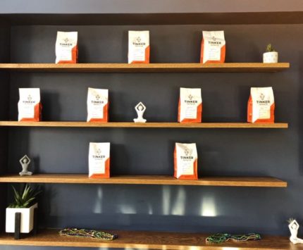 Bags of Tinker Street Coffee displayed artfully on shelves