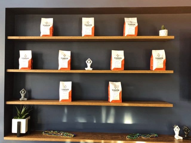 Bags of Tinker Street Coffee displayed artfully on shelves