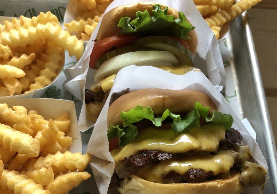 A tray of cheeseburgers and fries