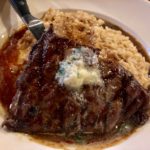 A flat iron steak with shallot butter and risotto