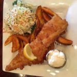 A plate of batter-fried fish and french fries