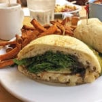 Tender roasted turkey, melted brie, sliced apple, and mixed greens are piled on an apple-butter slathered ciabatta roll