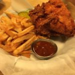 A basket of fried chicken and fries