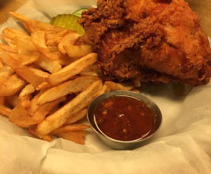 A basket of fried chicken and fries