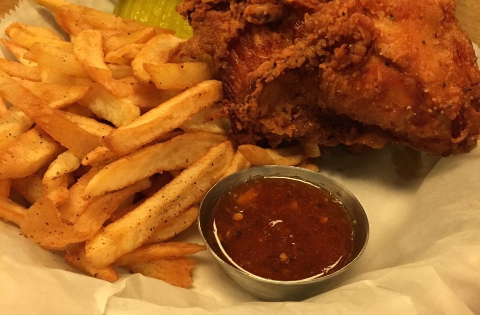 A basket of fried chicken and fries