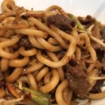 Asian noodles with beef and vegetables.