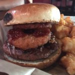 A veggie burger with a side of tots