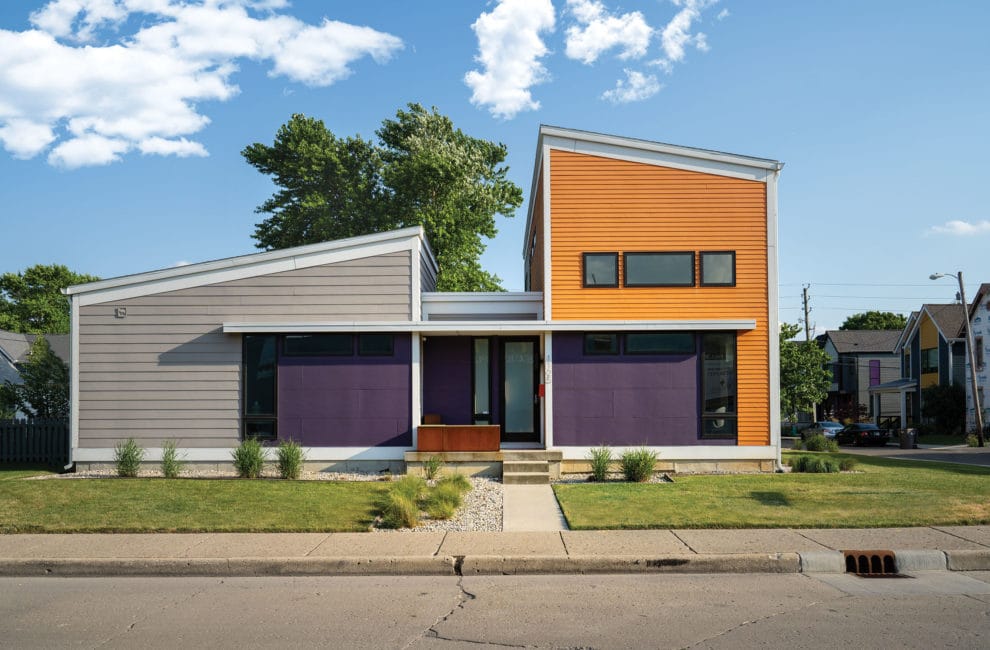 Exterior of modern home painted bright orange and purple