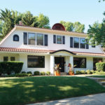 Two-story white house with tiled roof