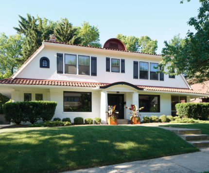 Two-story white house with tiled roof