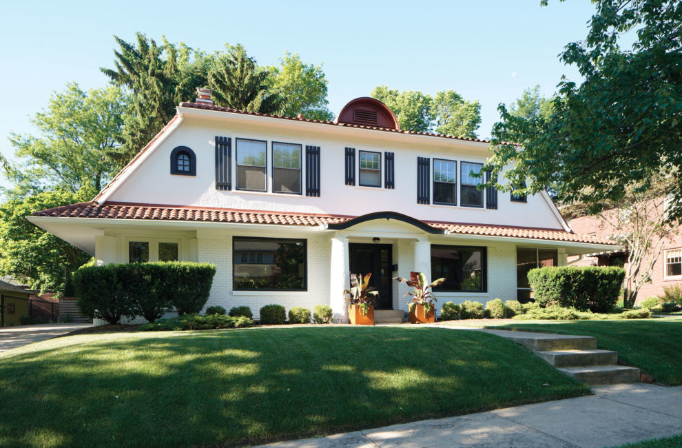 Two-story white house with tiled roof