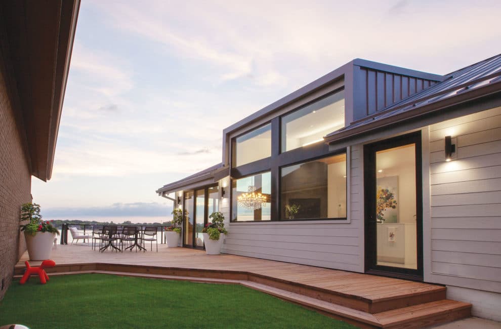 Exterior of contemporary lakehouse at sunset