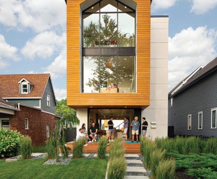 Exterior of modern home with people on porch