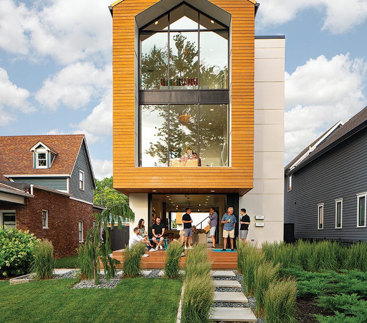 Exterior of modern home with people on porch