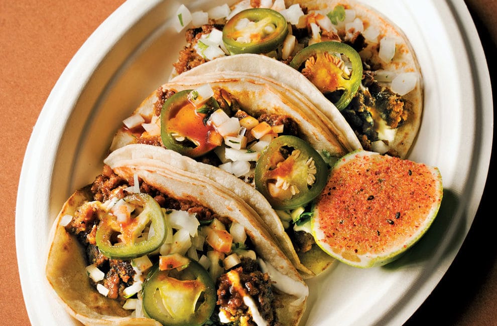 Three street tacos filled with the Filipino breakfast staple, spicy-sweet longanisa sausage.