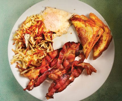 Bacon, eggs, toast, and hash browns.