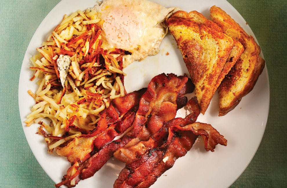 Bacon, eggs, toast, and hash browns.