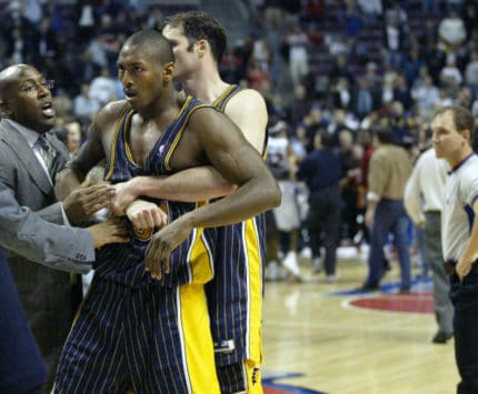 Austin Croshere holds back Ron Artest in this 2004 file photo from The Malice at the Palace.