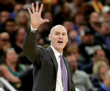 Indiana Pacers coach Rick Carlisle on the court holding up a high-five
