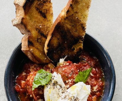 meatballs in red sauce with bread