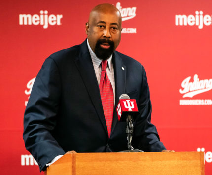 Coach Mike Woodson at a podium