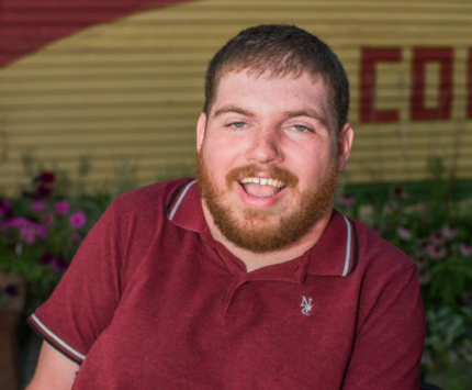 A man in a wheelchair outside