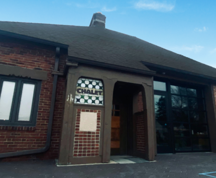 exterior of a fire station turned coffee and wine bar