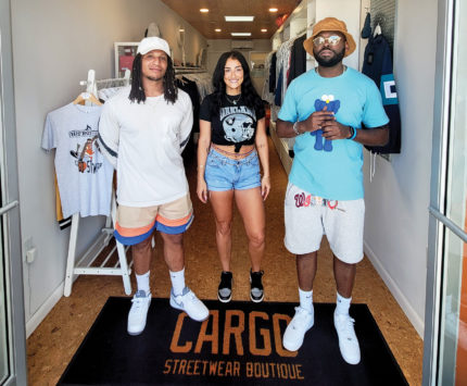 Cargo Streetwear Boutique crew in their shipping container store on Shelby Street in Fountain Square