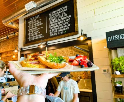 a restaurant counter with a menu behind it