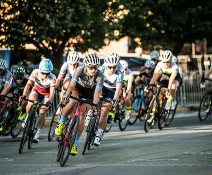 Bicyclists racing in The Mass Ave Crit