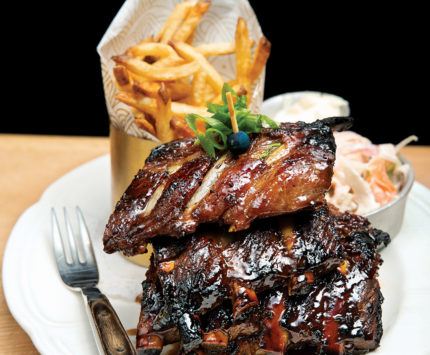 Ribs, fries, and slaw are on the menu at the fountain room