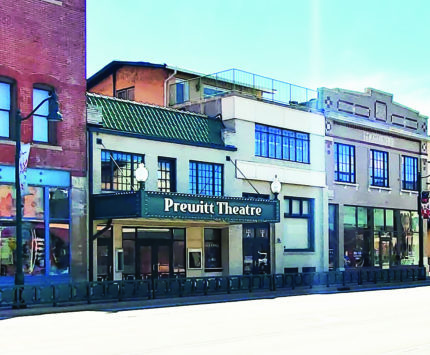 A rendering of the Prewitt Theatre in the middle of a row of buildings in Downtown Plain