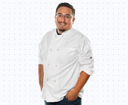 Chef Toby Moreno in a white chef's coat