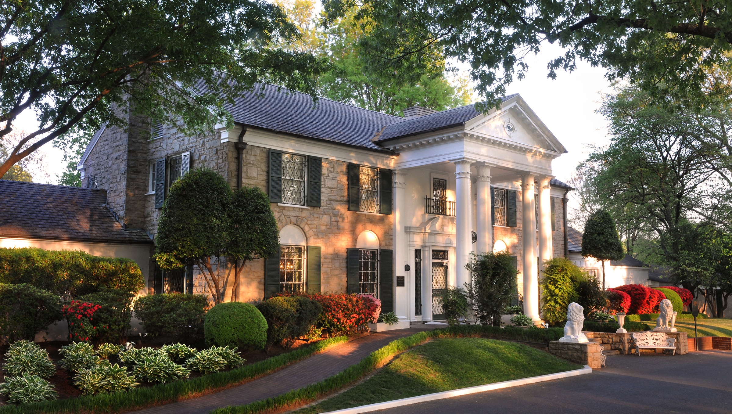 A photo of a white house, which is Graceland