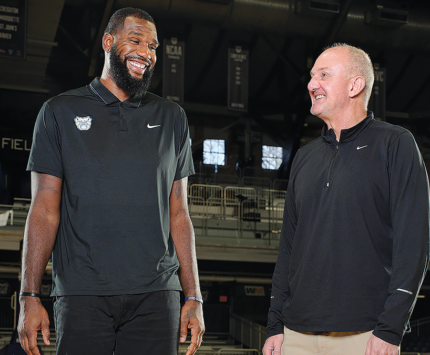 Greg Oden and Thad Matta on the Butler basketball court in Hinkle Fieldhouse
